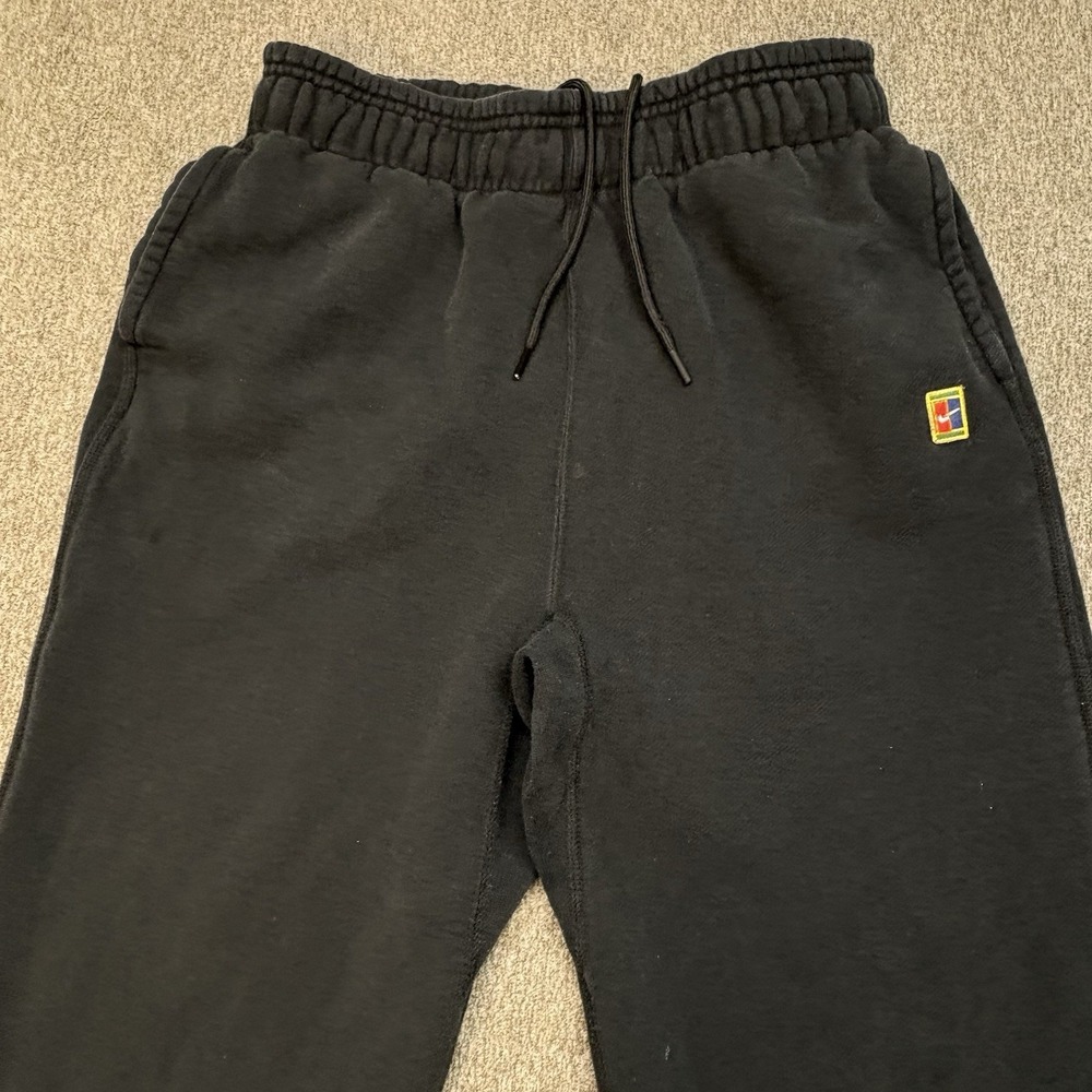 Vintage Nike Black Track Pants with Small Multicolor Logo